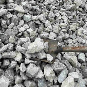 Number 1 and 2 size gravel with a shovel for scale